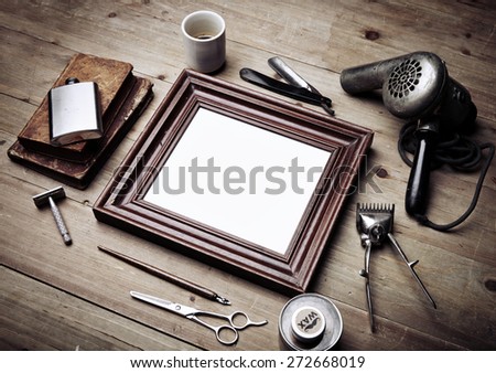 Set of vintage tools of barber shop and black picture frame