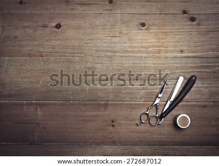 Vintage barber tools on wood background