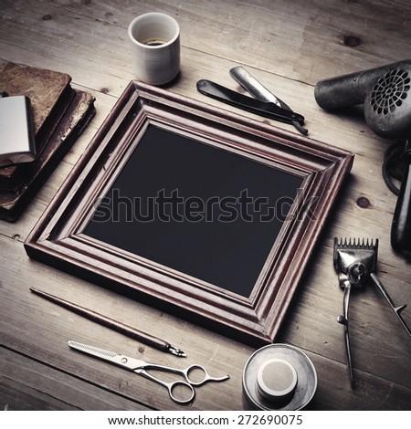 Set of vintage tools of a barber and old picture frame