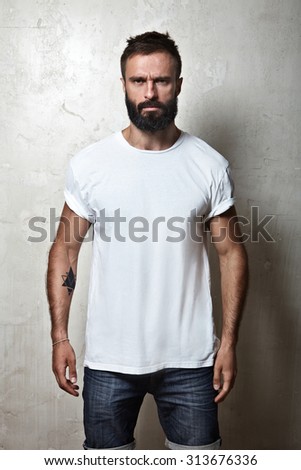 Portrait of a bearded guy wearing white blank t-shirt