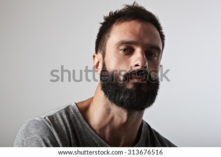 Close-up portrait of a brutal bearded man