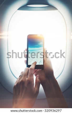 Mock up of smart phone in girl`s hand, with visual effects
