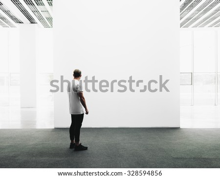 Open space gallery interior with empty canvas.