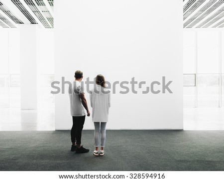 Man and woman walking through the gallery