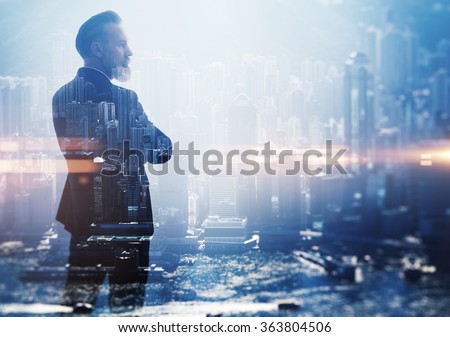 Double exposure photo a businessman and view of the city