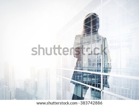 Photo of businesswoman. Double exposure, city on the background. Blurred background, horizontal