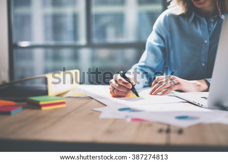 Photo young architect work concept. Woman working with new startup project in modern loft. Generic design notebook on wood table. Horizontal, film effect