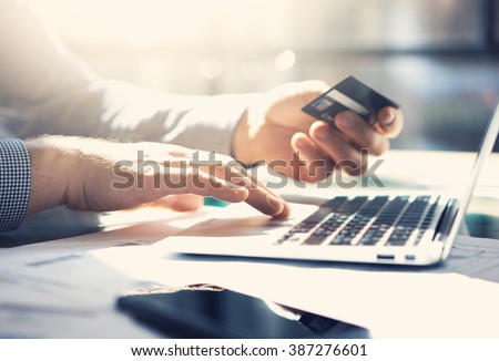 Photo businessman working with generic design notebook. Online payments, banking, hands keyboard. Blurred background, film effect. horizontal mockup