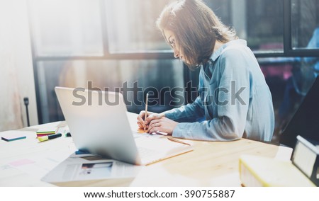 Account manager working picture.Photo young business woman  work with new startup project in office.Analyze document, plans.Generic design notebook on wood table, papers, documents.Horizontal, blurred
