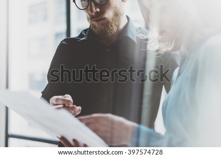 Business team work process modern office.Photo professional crew working with new startup project. Project managers meeting. Analyze  plans.Coworking world. Blurred background, film effect.Horizontal