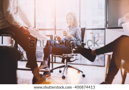 Brainstorming time.Photo young business crew working with new startup project.Idea presentation, analyze marketing plans. panoramic windows background.Creative process.Blurred background, film effect.