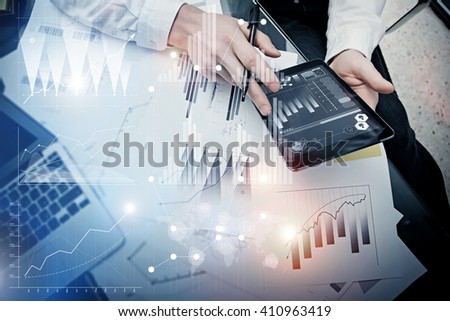 Investment banker working process.Picture trader work market report modern tablet.Use electronic device.Graphic icons,stock exchange reports interfaces.Business project startup.Horizontal,film effect