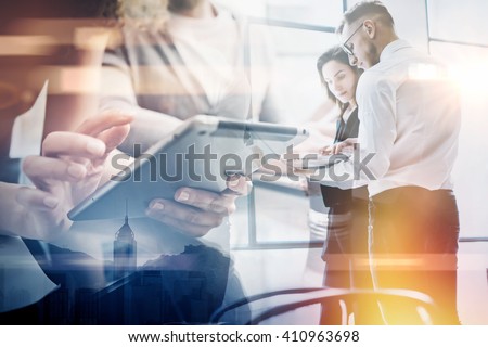 Business team work process.Double exposure photo professional crew working with new startup project.Investment managers meeting. Analyze business plans laptop.Blurred,film and bokeh effect. Horizontal