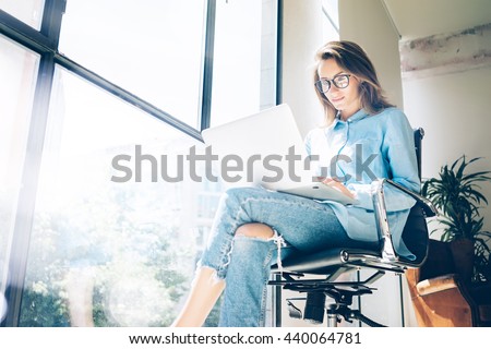Hipster Woman use Laptop huge Loft Studio.Student Researching Process Work.Young Business Team Working Creative Startup modern Office.Analyze market stock,new strategy.Blurred,film effect.Horizontal