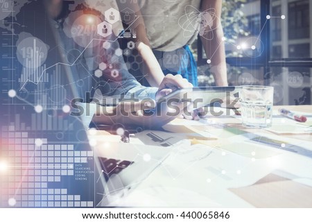 Woman Touching Screen Electronic Tablet Hand.Project Managers Researching Process.Business Team Working New Startup modern Office.International Digital Diagrams Interfaces.Analyze market stock.Blurred