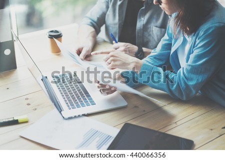 Sales Department Work Process.Photo traders reading market report modern laptop.Using electronic devices.Working graphics,stock exchanges data reports.Business project startup.Horizontal,film effect.