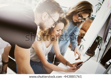 Coworkers Team Work Modern Office Place.Account Manager Showing New Business Idea Startup Presentation.Woman Touching Digital Tablet Screen.Desktop Computer Wood Table.Blurred,Film Effect.Horizontal