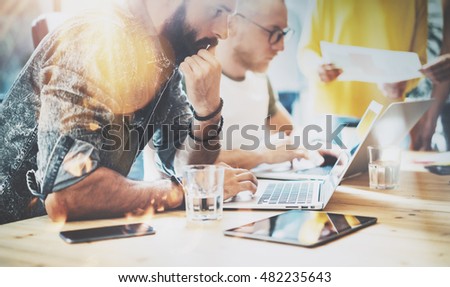 Startup Diversity Teamwork Brainstorming Meeting Concept.Business Team Coworkers Analyze Finance Report Laptop.People Working Start Up Process.Group Young Hipsters Discussing Office Blurred Background