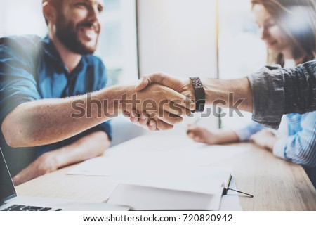 Business male partnership handshake concept.Photo two mans handshaking process.Successful deal after great meeting.Horizontal, blurred background