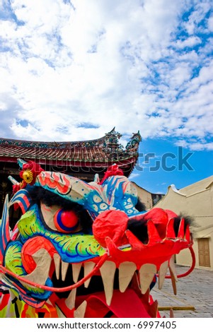 A puppet oriental dragon head with clear blue skies