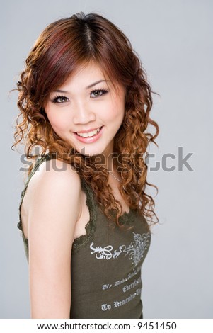 stock photo : curly hair asian woman with happy smile