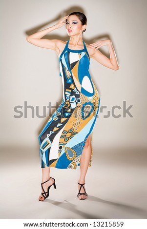 fashion asian model in colorful dress posing beautifully