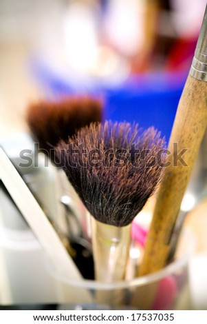 a bunch of makeup tools and brushes