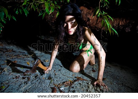 fierce asian woman crawling in the tropical green forest environment