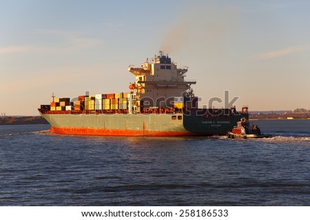 New York, NY, USA - January 18, 2013: Container ship KAETHE C. RICKMERS MAJURO standing on the roads at anchor. New York Bay.