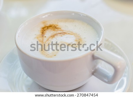 Hot Coffee in white cup and drink it in the morning with breakfast.