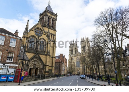 YORK, UK - MARCH 29: Street view from Dumcombe Place showing Saint Wilfrid\'s Church and York Minster at the back. March 29, 2013 in York.