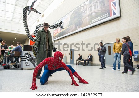 LONDON, UK - May 26: Spiderman and Doctor Octopus cosplayers posing at the MCMExpo at the Excel Centre. May 26, 2013 in London.