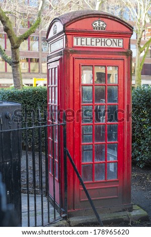 Old red telephone booth in Smithfield meat market in London, UK