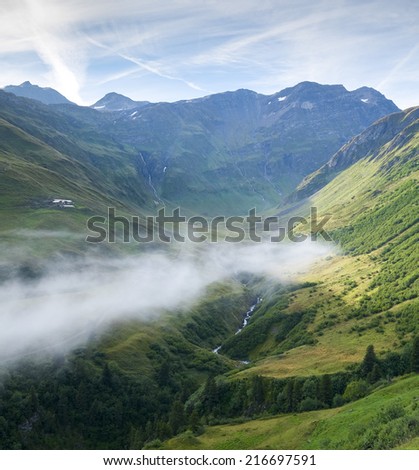 Composite of low hanging cloud in La Peule valley, Switzerland, with PercÃ?Â?Ã?Â© Mountain in the background. The region is one of the stages in the popular Mont Blanc tour, which crosses three countries.