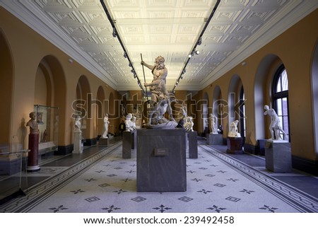LONDON, UK - DECEMBER 20: Victoria and Albert museum\'s Medieval and Renaissance room, with statue of Neptune and Triton in the centre. December 20, 2014 in London.