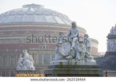Albert Memorial statue overlooking hazy Royal Albert Hall, in London. The concert hall is home to the Proms, which take place each summer since 1941.