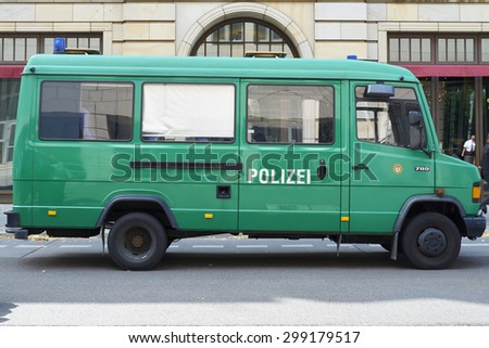 BERLIN, GERMANY - JULY 08: Empty green police van parked in the street. July 08, 2015 in Berlin.