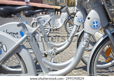 VERONA, ITALY - JULY 11: Low angle cropped shot the city\'s cycle hire bicycles parked in line. July 11, 2015 in Verona.