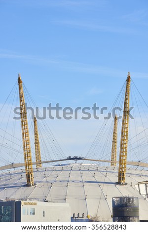 LONDON, UK - DECEMBER 28: Visitors at top of O2 Centre, formerly known as Millennium Dome, in a sunny blue sky day. December 28, 2015 in London.