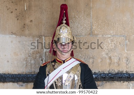 LONDON, UK - APRIL 02: Portrait of Royal Horse Guards in typical outfit. April 02, 2012 in London. The horseguard troopers carry out ceremonial duties and are the queens escort during state visits.