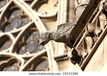 The Gargoyles in front of the Rose Stained Glass window at Notre Dame Cathedral, Paris