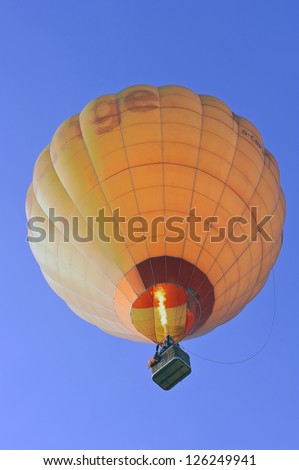 Big balloon on blue sky.