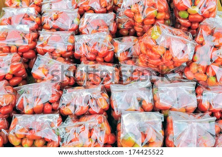 Tomatoes queen packed in plastic bags.