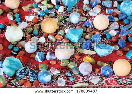 Collection set of mineral stone close up on red carpet.