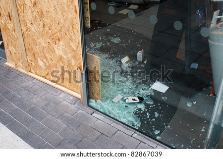 BIRMINGHAM, UK - AUGUST 10: A smashed window of a betting shop after it was smashed by looters on the 10th of August 2011, Birmingham, UK