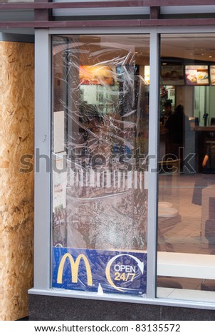 BIRMINGHAM - AUGUST 11 : The window of McDonalds smashed after a riot on August 11, 2011 in Birmingham, UK.