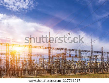 distribution electric substation with power lines, at sunset