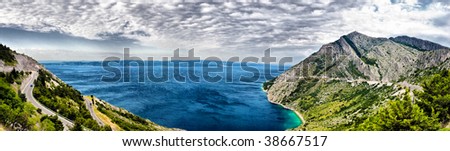 Scenic panorama view of the mountains, clouds and sea in Croatia. HDR nature background.