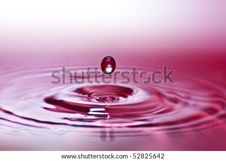 Red water environmental abstract background - red water drop splashing in clear clean water