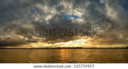 sunset over the lake, the sunset over the water, evening sunset, the sky at sunset, the clouds at sunset, sunset over the cloudy sky,